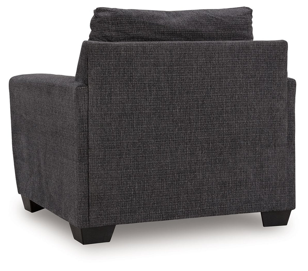 Loreo chair with dark gray fabric upholstery, wide seat, and sturdy dark legs