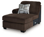 Chocolate-brown corner chaise with patterned cushion on backrest and padded seat