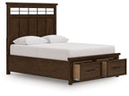 Dark brown storage bed with two drawers, panel headboard, and white pillows on frame