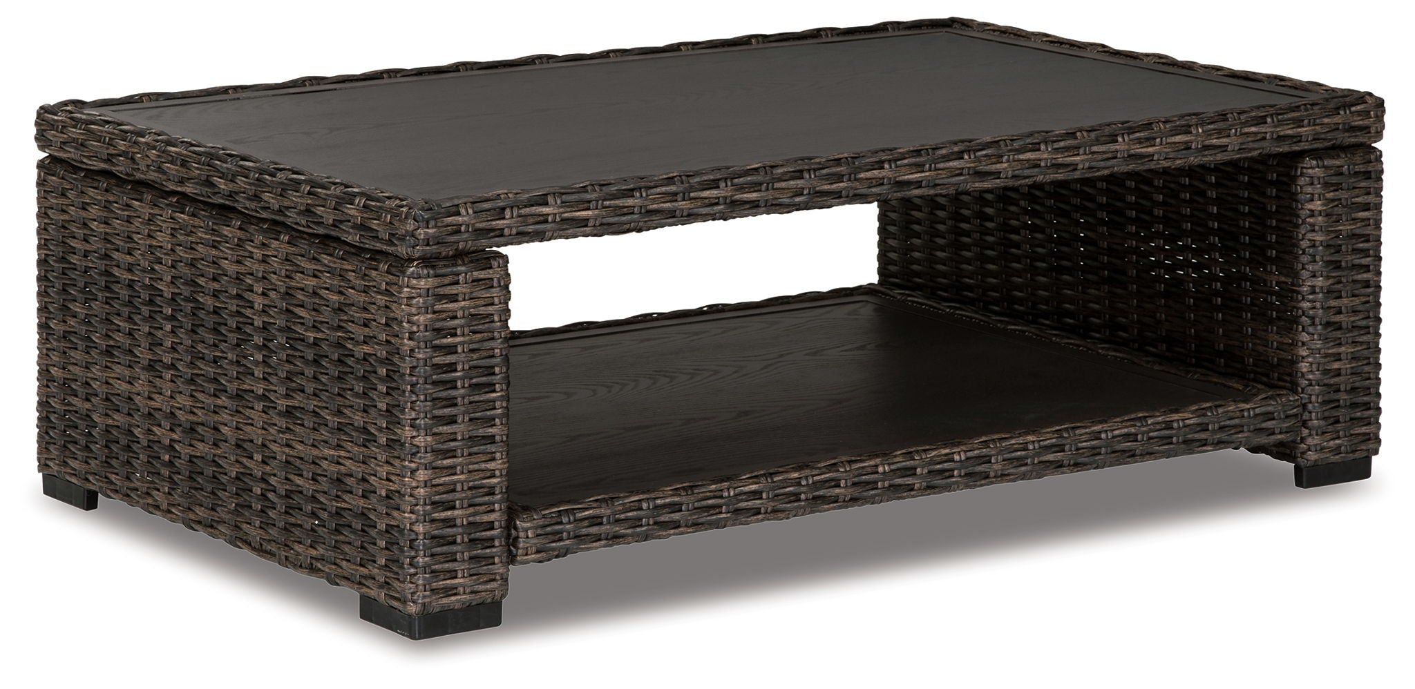 Brown wicker rectangular cocktail table with black glass top and lower shelf