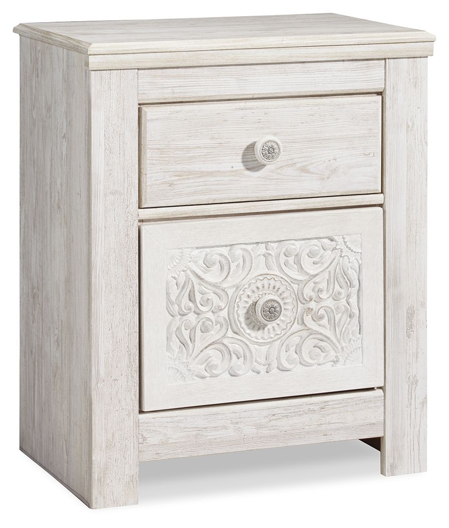 Whitewashed two-drawer night stand with upper drawer and ornate lower panel