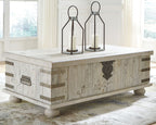 Whitewashed gray lift-top cocktail table with metal strap accents and sturdy legs