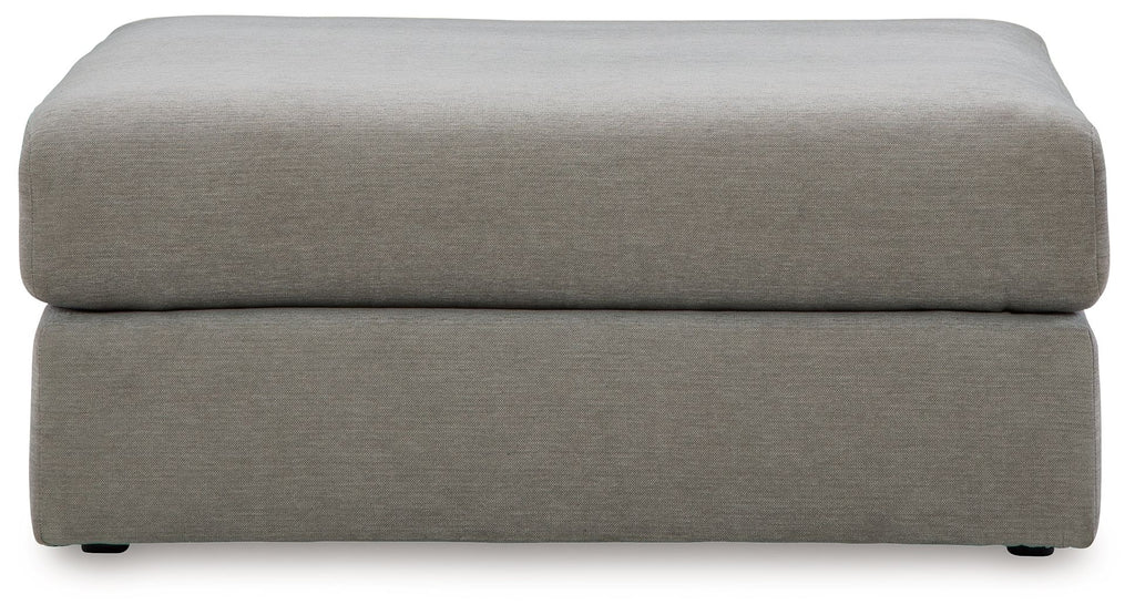 Upholstered oversized ottoman in ash gray with square top and block legs