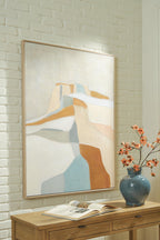 Framed abstract wall art with pastel blocks and curved lines in tan and blue