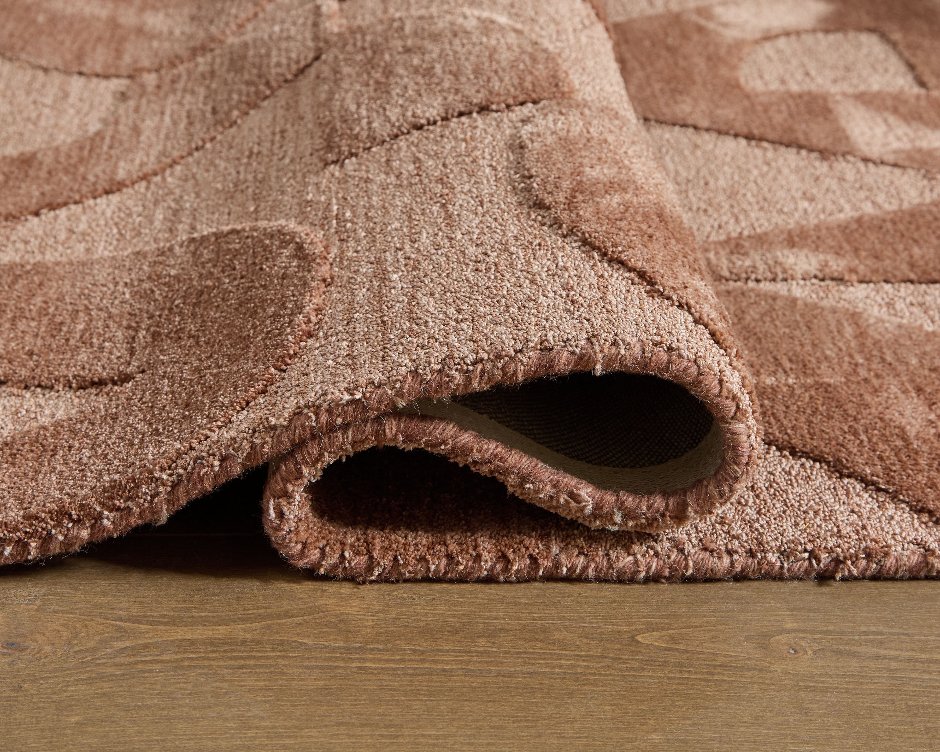 Perrenton rug corner close-up, short textured pile with visible underside