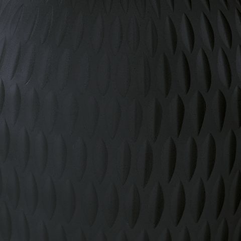 Etney vase close-up, dark gray embossed wave texture across ceramic surface