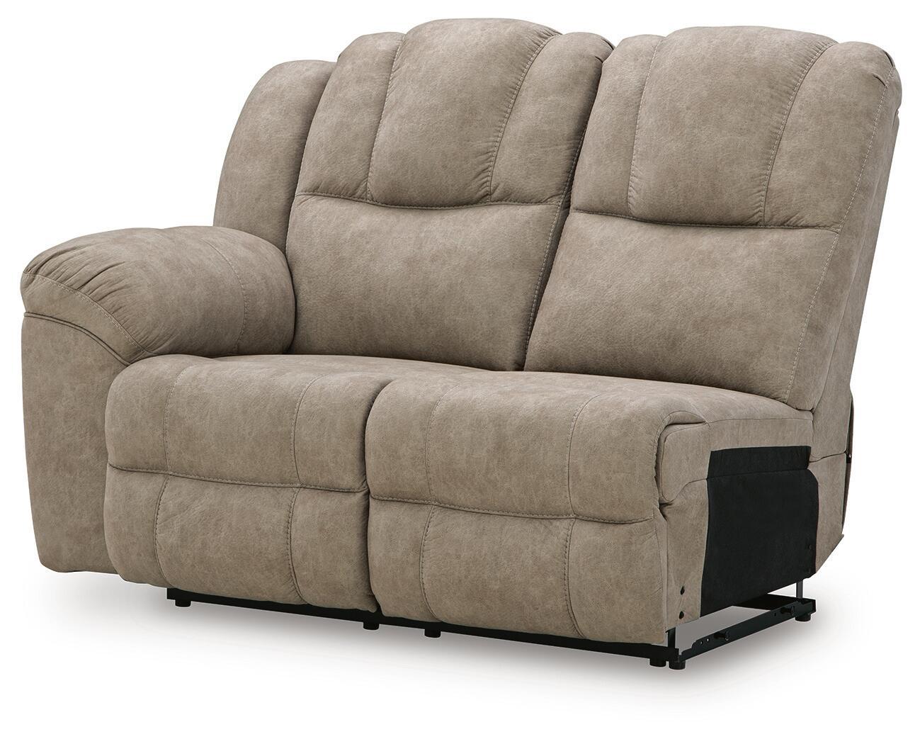 Light beige reclining loveseat with dual back cushions and smooth chaise footrest