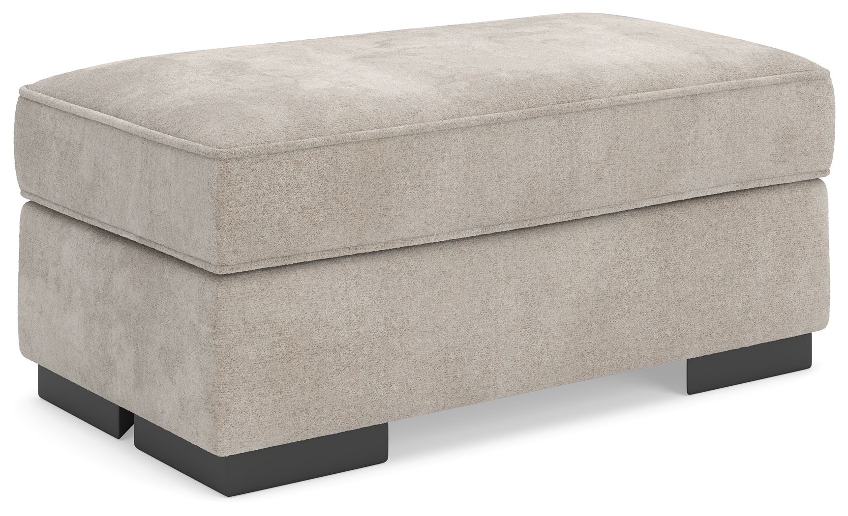 Taupe upholstered ottoman with padded top and black base legs, rectangular profile
