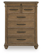 Medium brown wooden chest of drawers with seven drawers and dark metal bar handles