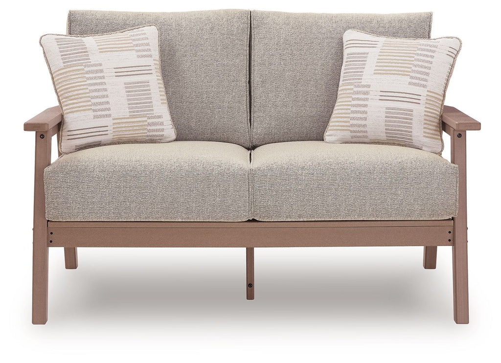 Light gray loveseat with driftwood frame, two square pillows, and divided back cushions.