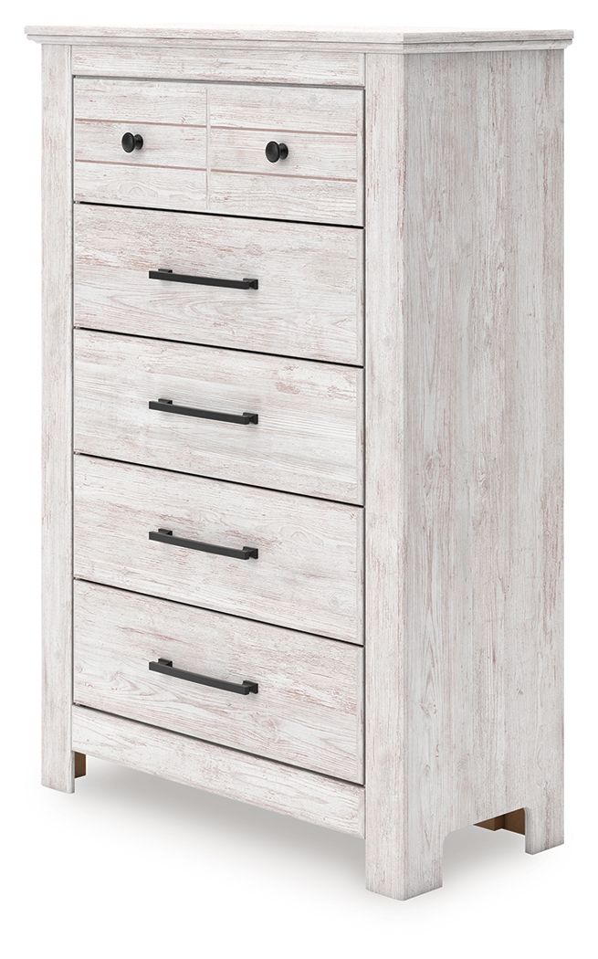 Whitewashed five-drawer chest with black bar and knob pulls