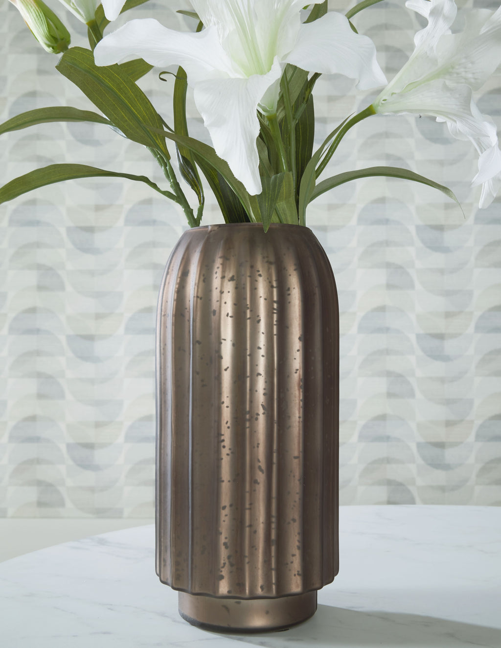 Tall metallic vase with vertical ribbed texture, dark brown finish