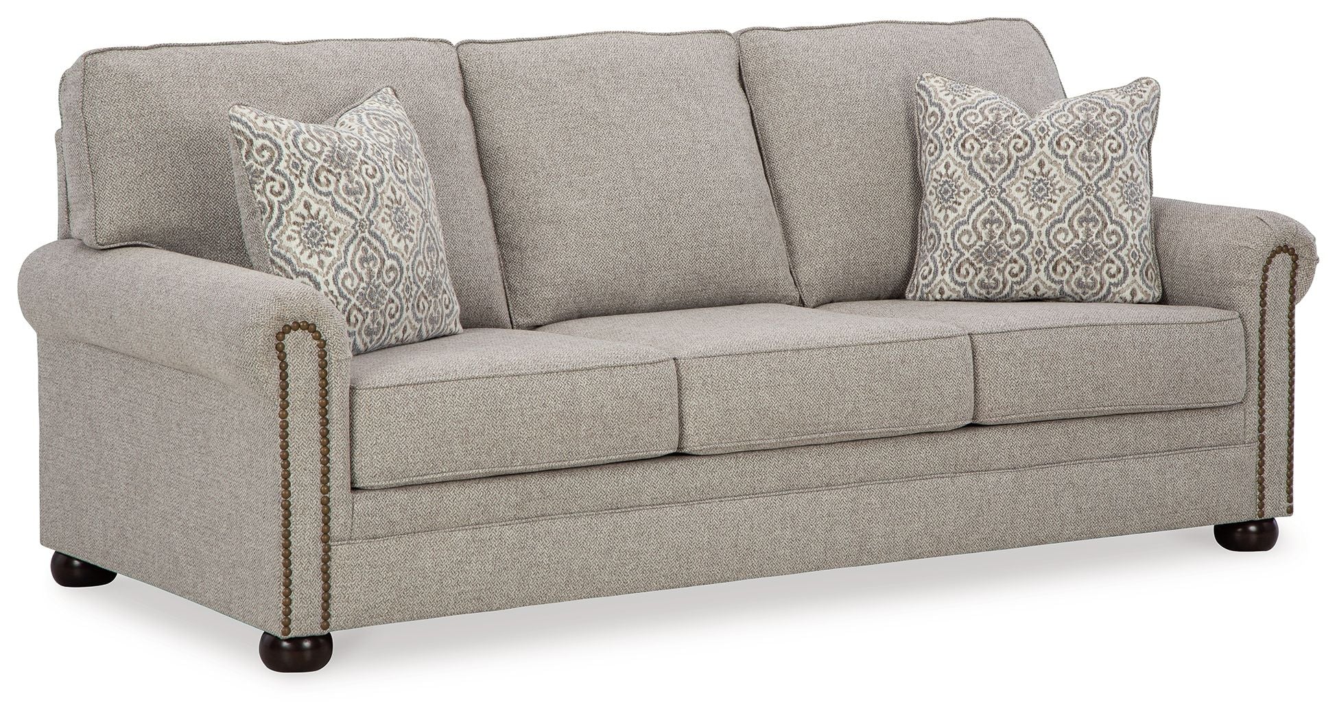 Queen sofa sleeper with light gray upholstery, three seat cushions, and two patterned pillows