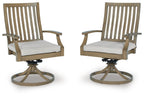 Pair of swivel patio chairs with light gray cushions, brown slatted backs and round bases
