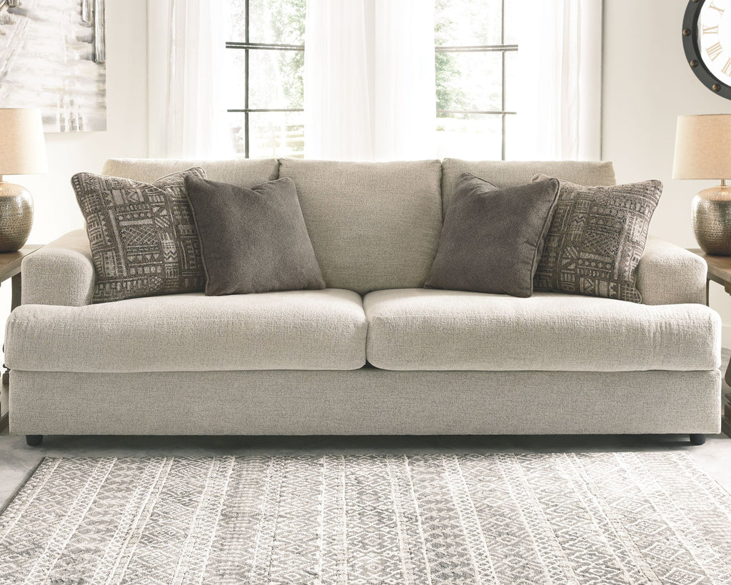 Soletren stationary sofa, light stone seating with multiple gray and patterned pillows