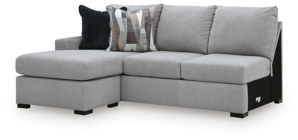 Lakepoint LAF sofa chaise with light gray upholstery, chaise extension, and patterned throw pillows