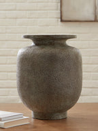 Gray stone-look vase with flared neck on tabletop