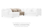 Armless loveseat component with light beige cushions inside a sectional