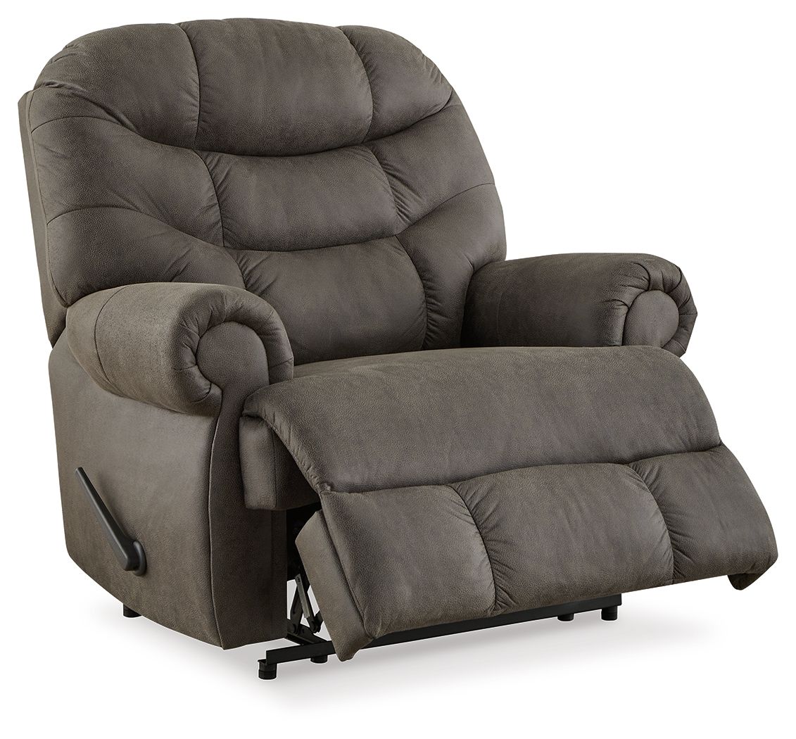 Gunmetal recliner with plush back, padded headrest, and side recline mechanism.
