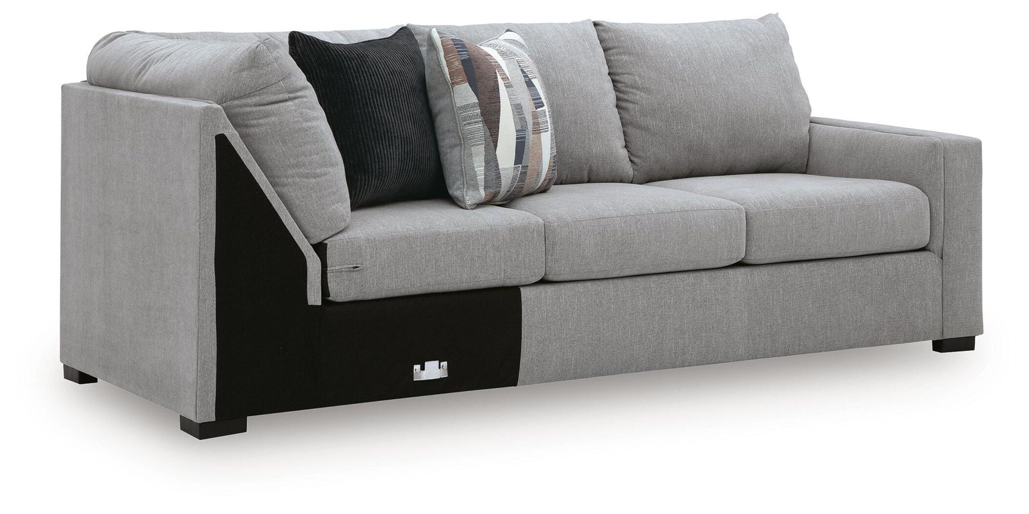 Gray fabric RAF sofa with corner wedge, patterned and dark throw pillows, black legs
