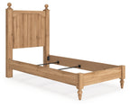 Light brown wooden panel bed with white mattress, open frame and slats