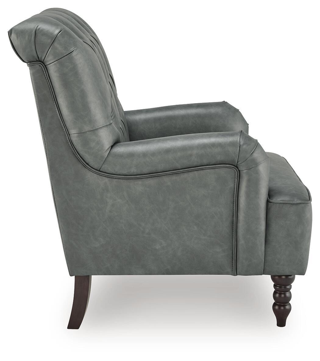 Slate gray upholstered accent chair with curved arm detailing, tufted back, and dark wood legs.