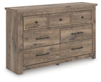 Light brown rustic dresser with seven drawers and metal bar pulls