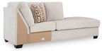 Stone corner chaise with geometric throw pillow, side latch detail and black legs