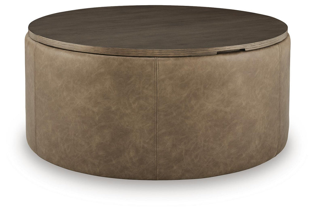 Round warm brown storage ottoman with hinged top and faux-leather upholstery