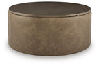 Round warm brown storage ottoman with hinged top and faux-leather upholstery