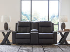 Black double reclining loveseat with center console and plush headrests for lounging
