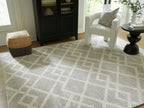 Gray geometric rug with repeating diamond pattern, square corners