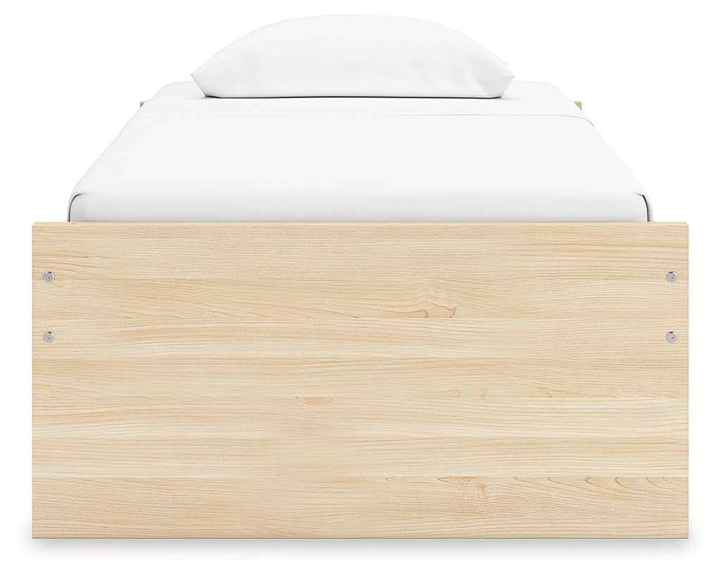 Platform bed with light brown wood headboard panel and metal corner fasteners