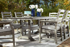 Gray outdoor dining table with six matching slat-back chairs