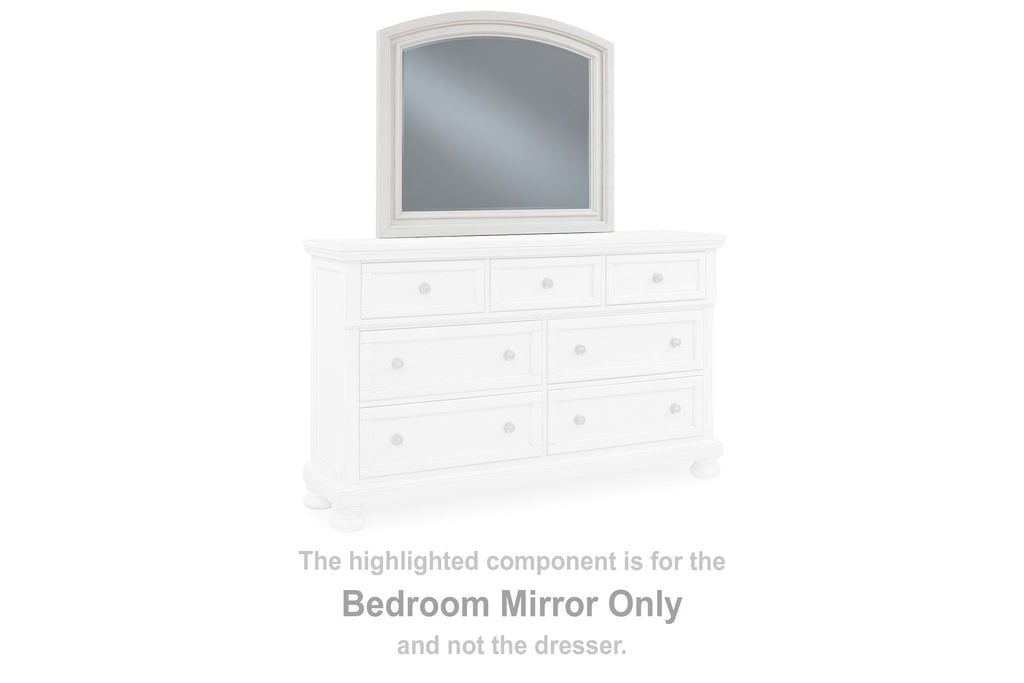 Antique white arched bedroom mirror on dresser top