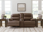 Power reclining loveseat with console and adjustable headrests, dark brown leather cushions