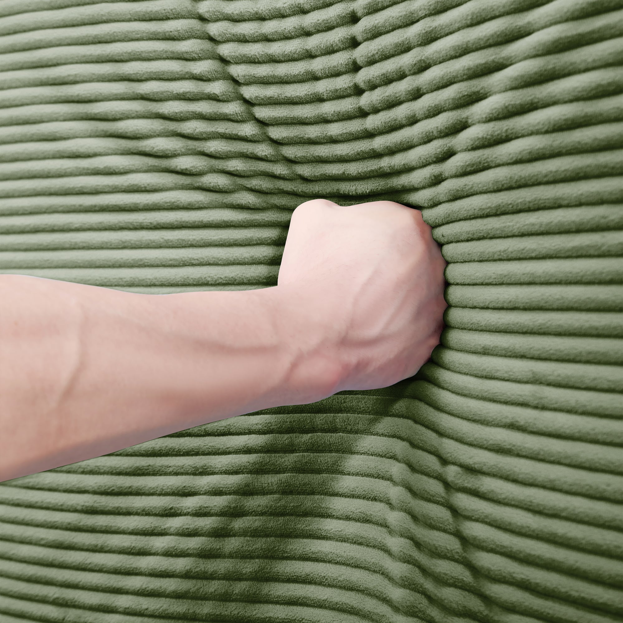 Green corduroy sectional sofa with arm resting on textured seat