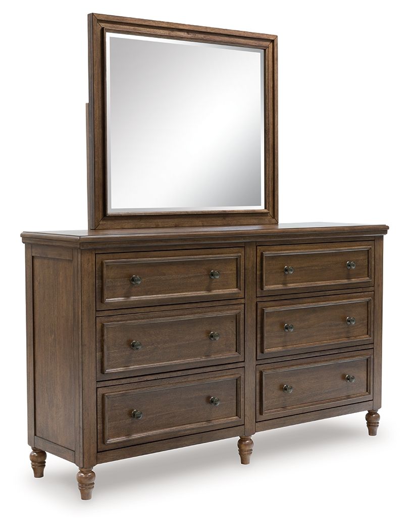 Brown wooden dresser with framed mirror and six drawers with metal knobs