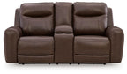 Dark brown power reclining loveseat with three padded back sections and console armrest.