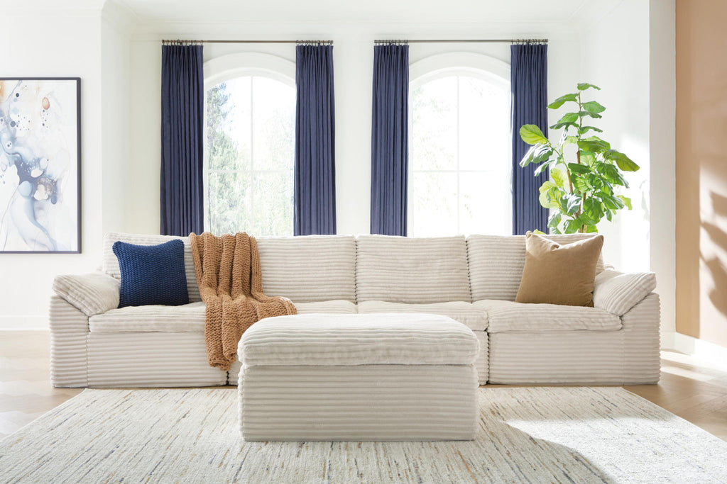 Fannin ivory 4-piece sectional with ottoman and lumbar pillows, corner layout