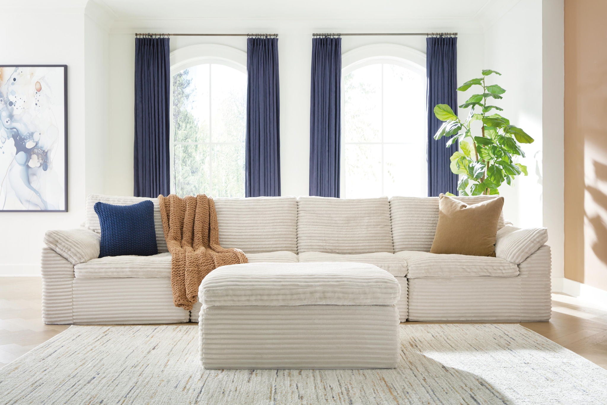 Fannin ivory 4-piece sectional with ottoman and lumbar pillows, corner layout
