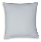Solid light blue throw pillow with smooth fabric and stitched edges