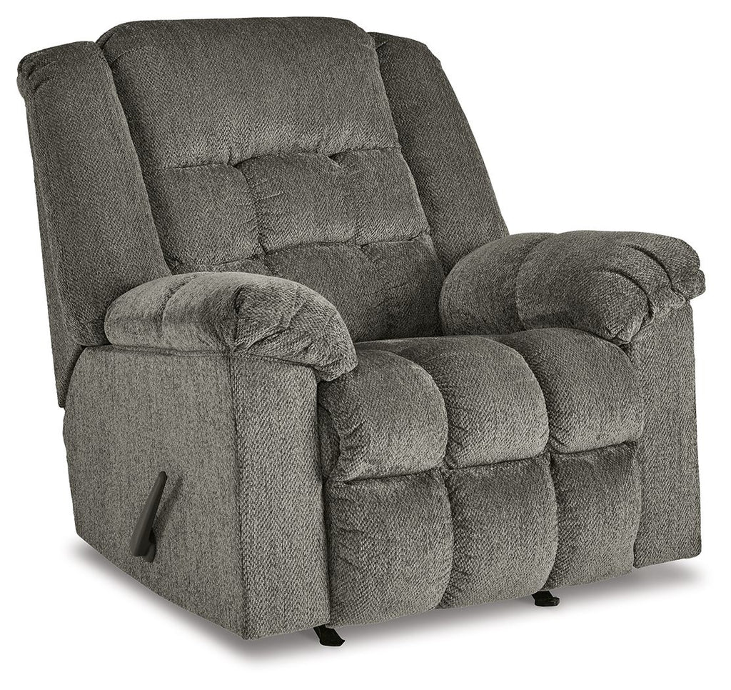 Gray rocker recliner chair with tufted back, padded arms, side control handle