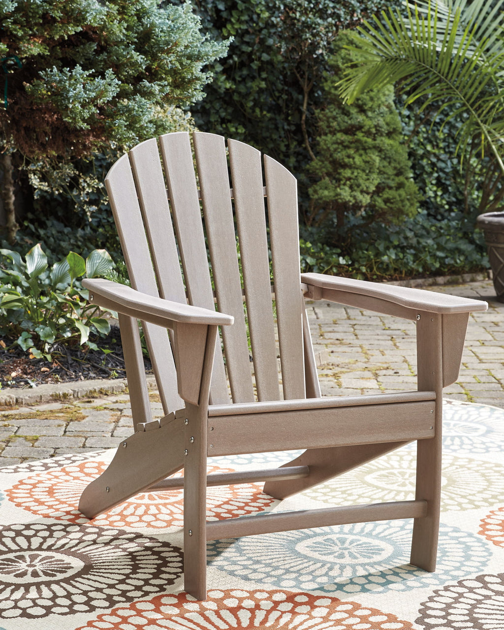 Outdoor adirondack chair, light brown wood slat back and armrests