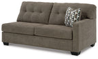 Fabric sofa sleeper with three seat cushions and square arms, dark gray with patterned pillow