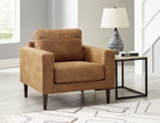 Light brown upholstered armchair with matching ottoman and padded backrest