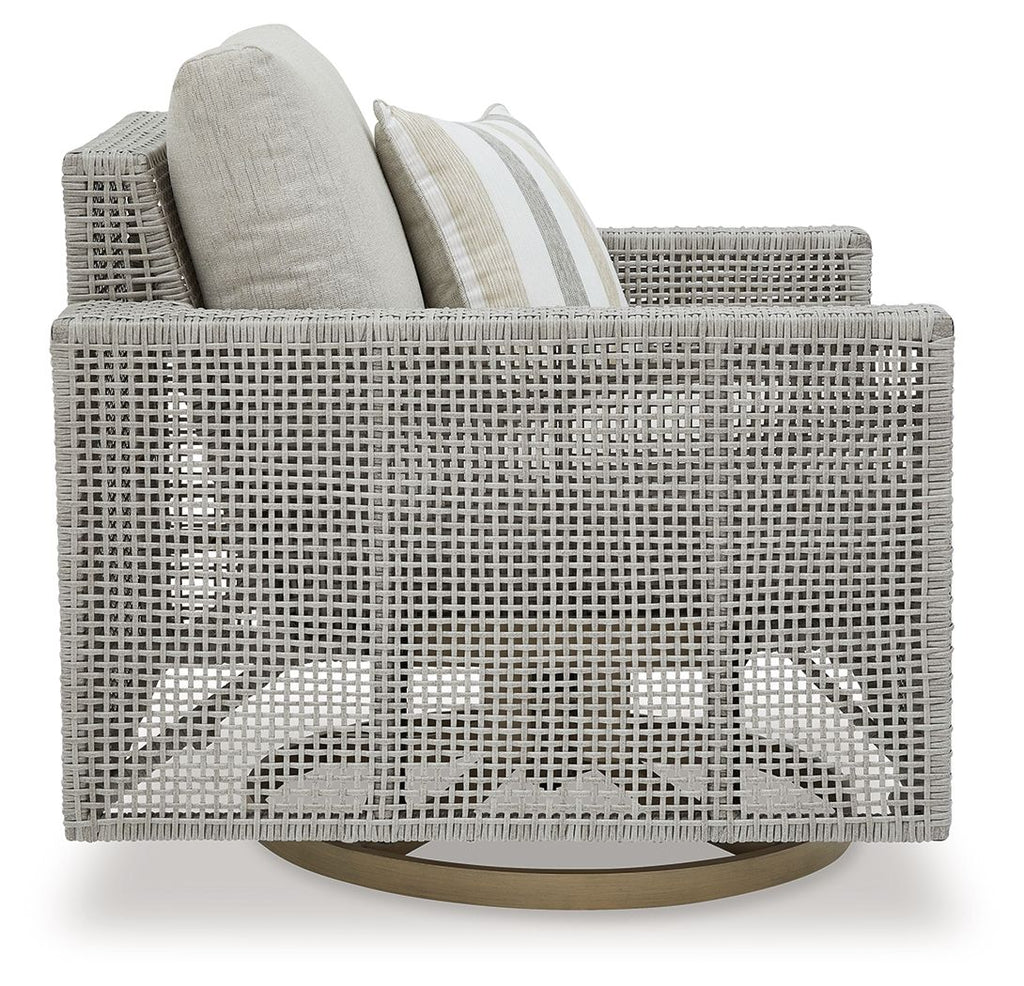 Gray swivel lounge chair with woven back, seat cushion, and striped throw pillow