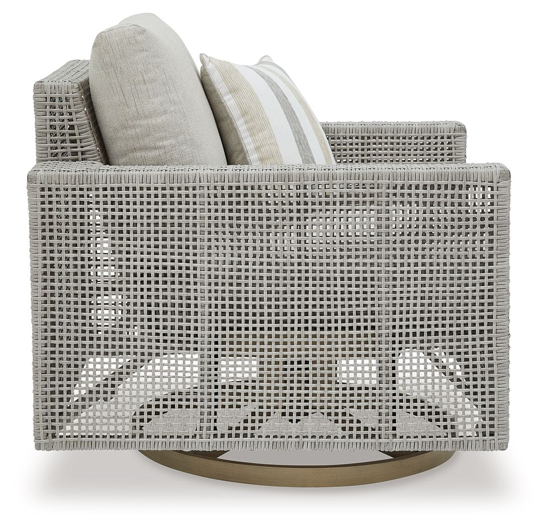 Gray swivel lounge chair with woven back, seat cushion, and striped throw pillow
