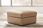 Toffee leather-look ottoman with padded square top and low tapered base