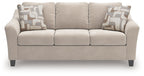 Taupe queen sofa sleeper with three front cushions and two patterned accent pillows